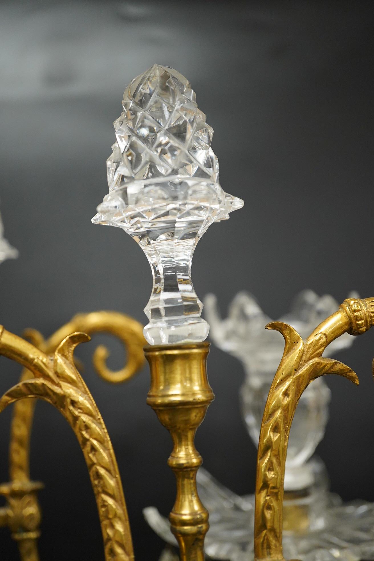A pair of 19th century glass and gilt metal two branch candelabra with drops, 40cm high